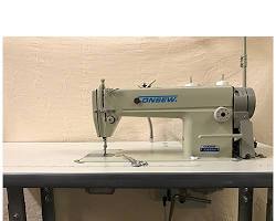 Straight-stitch machine for industrial sewing